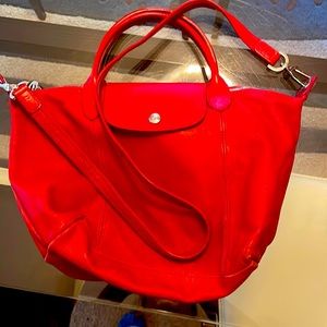 Red leather Longchamp bag.  Ok condition